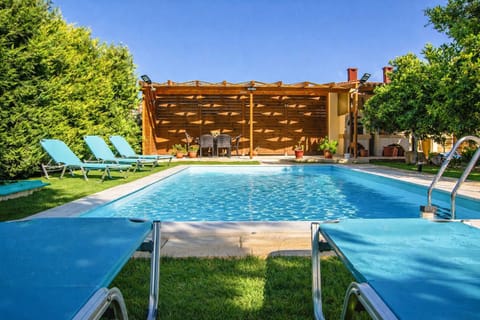 Swim, sunbathe, and unwind beside the private pool, set in a quiet garden with citrus trees and mountain views.