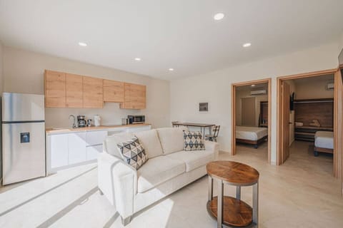 Open living, kitchen, and two bedrooms.