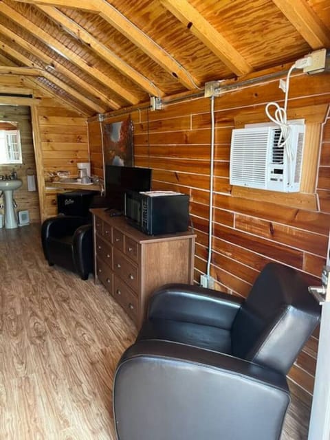 Chill, stream, and snack with two comfy seats, AC, smart TV, and microwave.