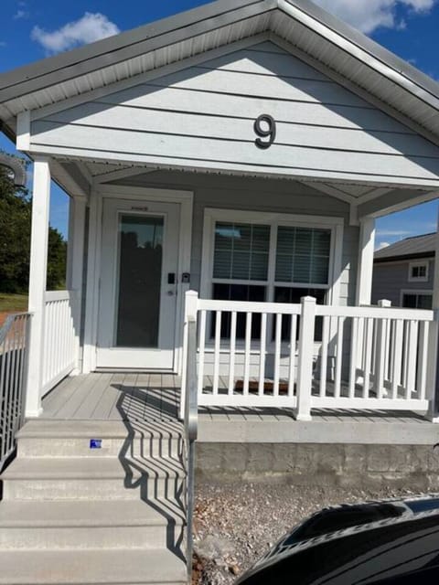 An inviting front patio that offers a peaceful spot to sit back, take in the fresh air, and enjoy quiet moments outdoors.