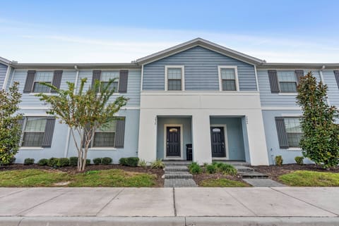Welcome to this charming vacation home with its refreshing blue exterior and beautifully landscaped grounds. Large windows fill the space with natural light, creating a bright and inviting atmosphere for your stay.