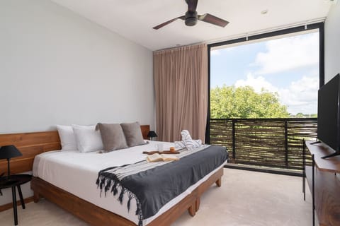 Relax in a spacious king bed offering comfort and peaceful rest.