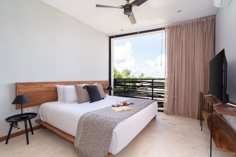 Cozy king bed offering softness, support, and a restful night’s sleep.