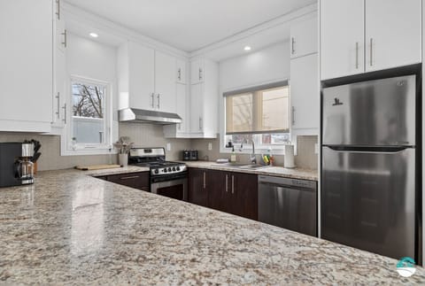 Complete kitchen with two windows