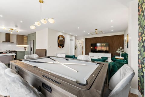 Spacious dining table which converts into a pool, ping pong and air hockey table