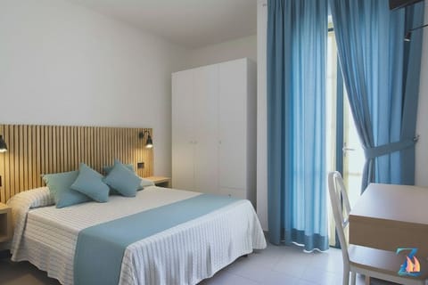 Classic Double Room, Balcony, Partial Ocean View | Minibar, in-room safe, desk, blackout drapes