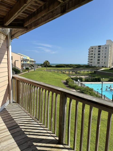 View of outdoor common area, main pool and ocean.