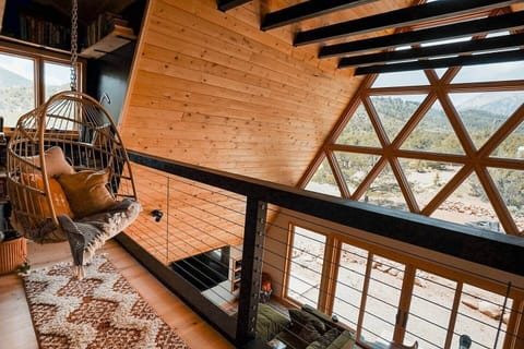 Enjoy the mountain views from a hanging egg chair cozied up in the book nook.