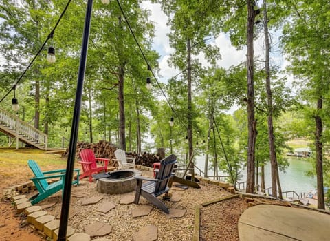 Fire Pit Area | Adirondack Seating, String Lights & Lake Views