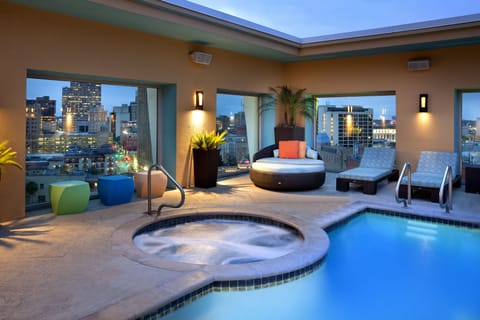 Outdoor pool, a heated pool, open 8:00 AM to 10:00 PM, free cabanas