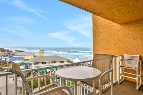 Relax on this private oceanview balcony with seating and table, perfect for your beach stay. Enjoy coastal breezes, waves, and nearby shoreline views just steps from the sand.