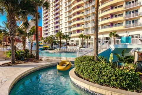 Enjoy the ultimate beach stay with a resort-style pool and lazy river surrounded by palm trees. Perfect for relaxing days in the sun, family fun, and effortless coastal vacation vibes just steps from the beach.