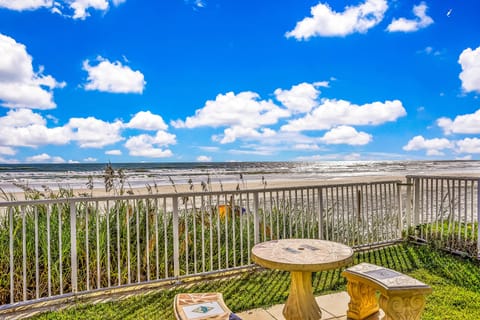 Take in stunning ocean views during your beach stay from this peaceful outdoor seating area. Enjoy salty breezes, sandy shores, and the perfect spot to relax just steps from the beach.
