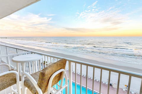Take in breathtaking ocean views from this private balcony during your beach stay. Enjoy sunrise coffee or sunset skies while overlooking the shoreline—perfect for relaxing moments by the sea just steps from the beach.