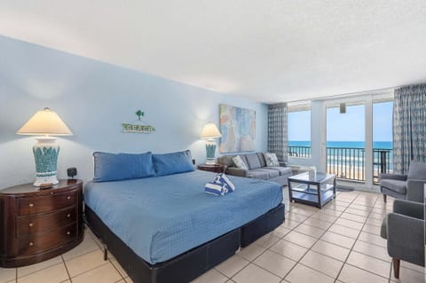 Unwind in this spacious oceanfront studio featuring a king bed, cozy sitting area, and private balcony with panoramic beach views. A perfect beach stay for relaxing to the sound of the waves and enjoying unforgettable sunrises.
