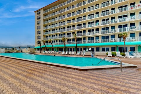 Enjoy your beach stay with a refreshing oceanfront pool, spacious sun deck, and lounge chairs just steps from the sand. Perfect for cooling off, relaxing poolside, and soaking in coastal vacation vibes.