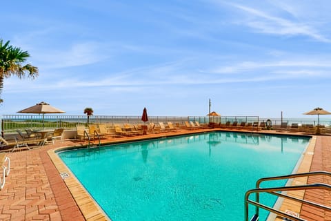Relax by this oceanview pool deck with plenty of loungers and stunning coastal views. An ideal amenity for your beach stay, offering the perfect blend of poolside comfort and easy access to the shore.