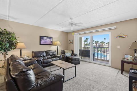 Relax in this spacious beach stay featuring cozy seating, natural light, and a private balcony overlooking the pool. Perfect for unwinding after a day at the beach, just minutes from sun, sand, and coastal attractions.