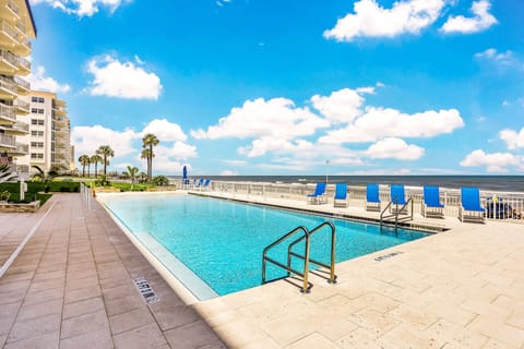 Enjoy a relaxing beach stay at this oceanfront pool with stunning shoreline views. Lounge in the sun, cool off with a swim, and soak in the coastal atmosphere just steps from the sand.