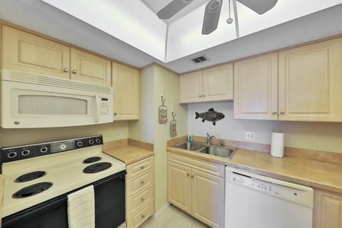 Clean, well-equipped kitchen with modern appliances and coastal accents. Ideal for cooking meals and beach-day snacks, making your beach stay comfortable, convenient, and stress-free.