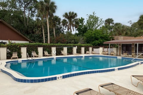 Relax at this inviting community pool, perfect for your beach-vacation downtime. Enjoy plenty of seating, sunny skies, and refreshing swims just minutes from your coastal stay.
