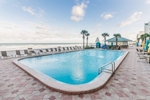 Enjoy stunning ocean views at this refreshing beachfront pool. Relax on lounge chairs, soak up the sun, and make the most of your coastal getaway with the perfect beach stay vibes.