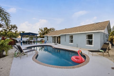 Enjoy your private heated pool with plenty of seating, sunny patio space, and peaceful backyard views perfect for morning dips and sunset swims.