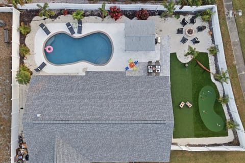 This bright blue coastal-style home offers a warm welcome with ample parking, peaceful surroundings, and easy access to Bradenton’s top beaches and attractions.