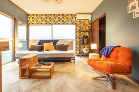 A playful and inviting lounge at Showa House Tokyo, perfect for relaxing with family or friends.