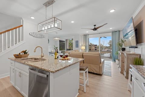 The open layout continues into the living room and dining area, ensuring ample space for everyone in your group to enjoy meals and conversations together.