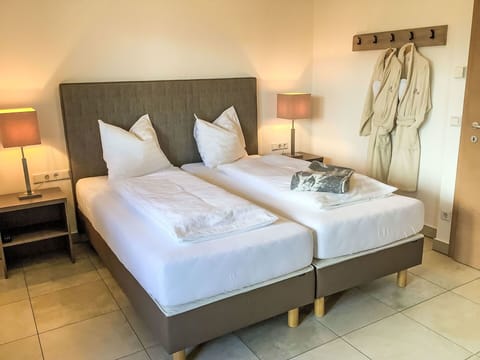 Furniture, Bed, Bedroom, Interior Design, Flooring, Floor, Bedding, Bed Sheet, Bed Frame, Throw Pillow
