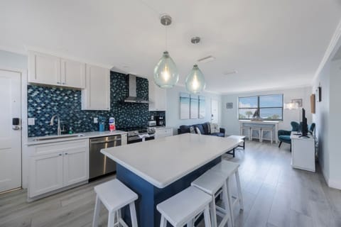 Kitchen stocked with cooking/eating/drinking utensils