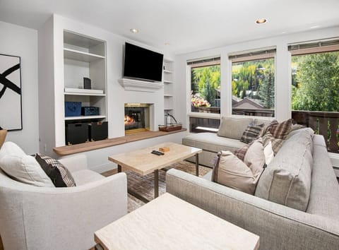 Spacious living room with beautiful views, gas fireplace, and smart TV