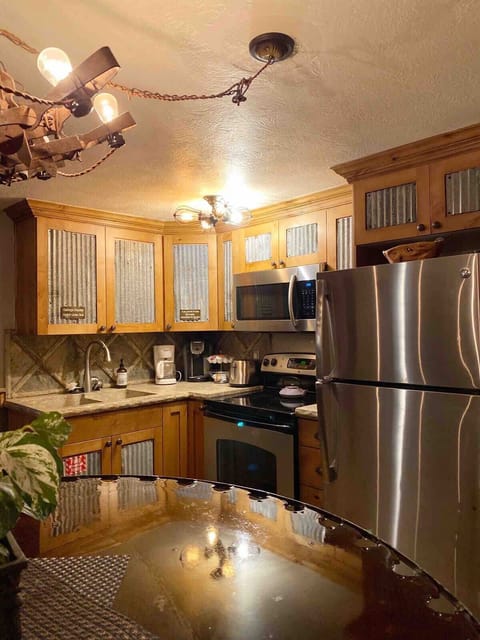 Small charming kitchen with all the appliances and kitchen amenities for you to cook a wonderful meal inside