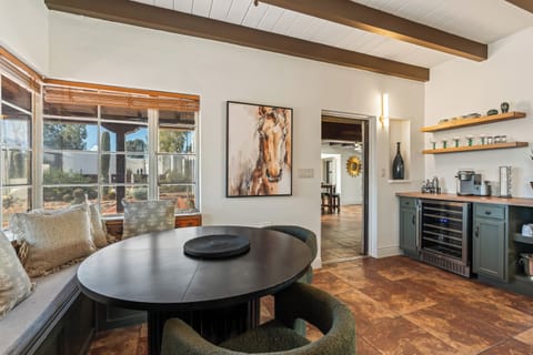 A built-in banquette and round table make quick meals pleasant and easy.