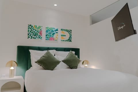 Bedroom 1 with movable Smart TV.