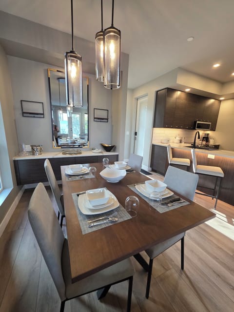 Open concept Dining area. Fully stocked with higher end dishes and glassware.