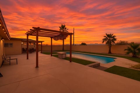 Breathtaking sunset views over the private pool and covered patio