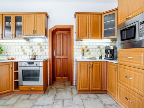Cabinetry, Kitchen, Kitchen Appliance, Major Appliance, Wood, Countertop, Flooring, Interior Design, Furniture, Drawer