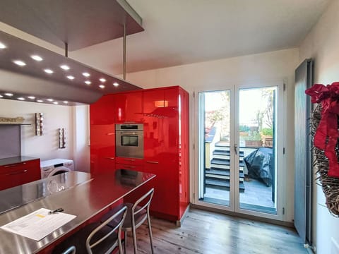 Flooring, Interior Design, Furniture, Kitchen, Ceiling, Floor, Wood, Countertop, Major Appliance, Light Fixture