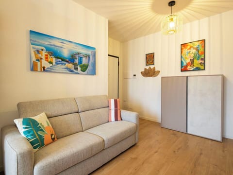 Furniture, Interior Design, Flooring, Floor, Couch, Wall, Room, Wood, Living Room, Picture Frame
