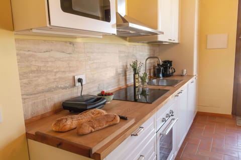 Countertop, Kitchen, Furniture, Wood, Flooring, Kitchen Appliance, Cabinetry, Food, Kitchen Sink, Interior Design