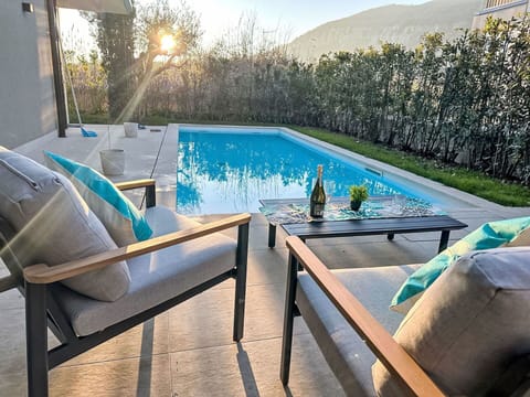 Furniture, Swimming Pool, Outdoor Furniture, Chair, Resort, Flooring, Floor, Outdoor Table, Shade