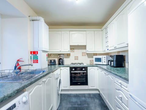 Interior Design, Flooring, Floor, Ceiling, Kitchen, Room, Cabinetry, Apartment, Kitchen Appliance, Countertop