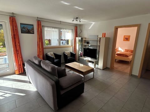 Furniture, Interior Design, Wood, Flooring, Couch, Floor, Room, Living Room, Ceiling, Table