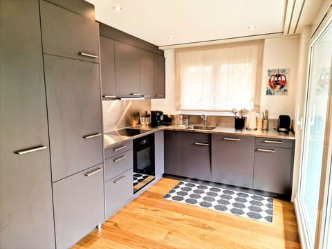 Kitchen, Kitchen Appliance, Cabinetry, Countertop, Furniture, Interior Design, Flooring, Major Appliance, Wood, Floor