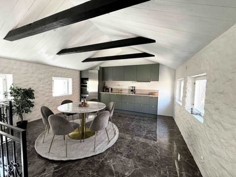 The upper floor with beautiful kitchen area with beautiful stone flooring. 