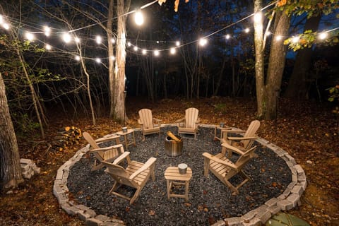 Large inviting fire pit under the canopy of the forest 