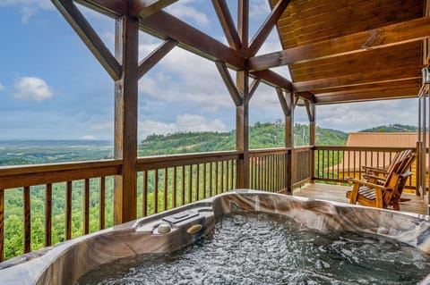 Relax in the hot tub while enjoying the view.