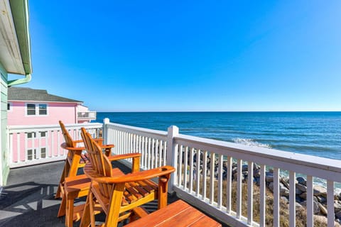 Settle into these oceanside chairs where endless blue waves meet your morning coffee ritual perfectly.